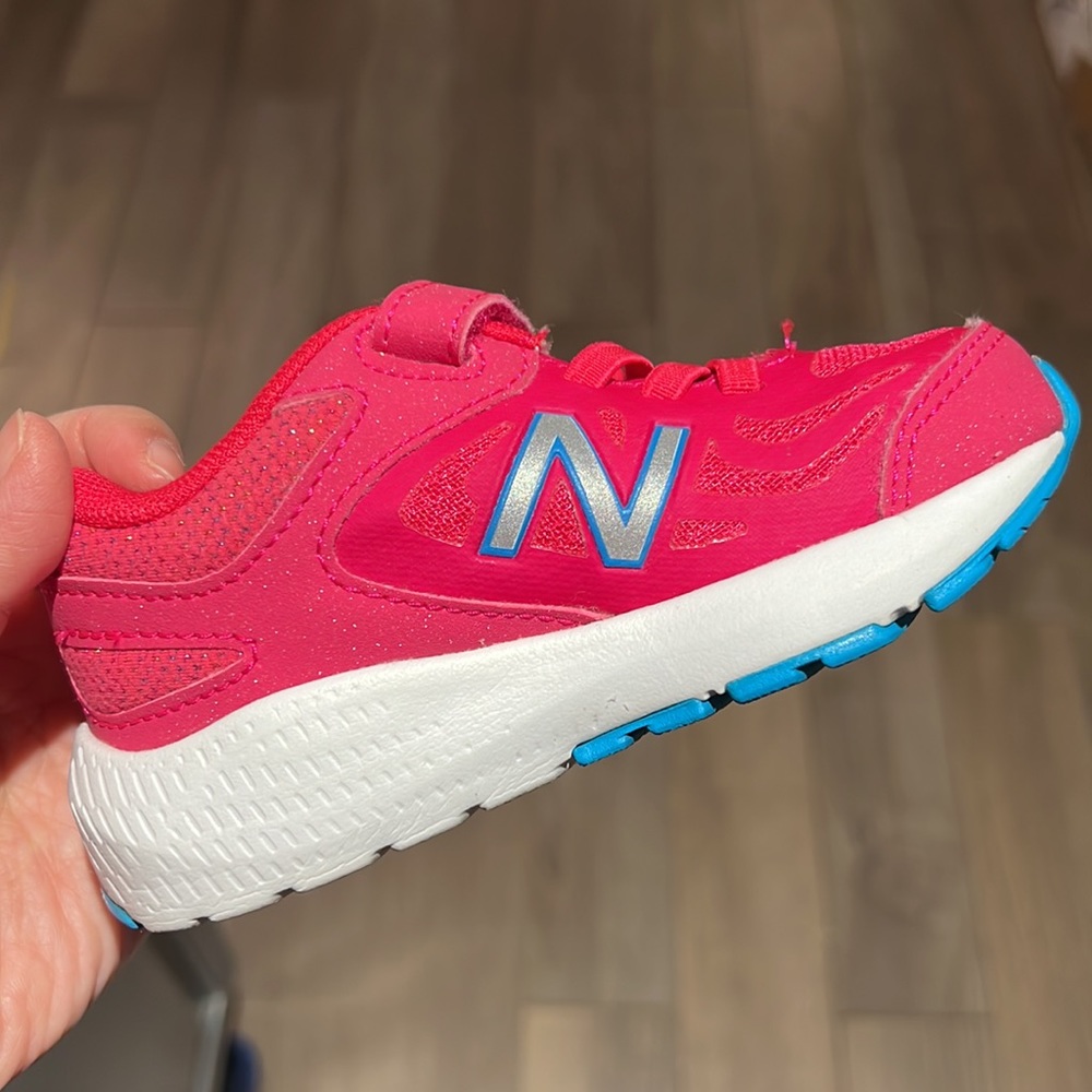 Toddler girl’s pink New Balance sneakers